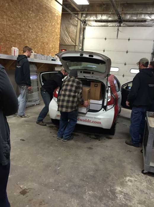 Team members loading boxes for food drive in Madison, WI