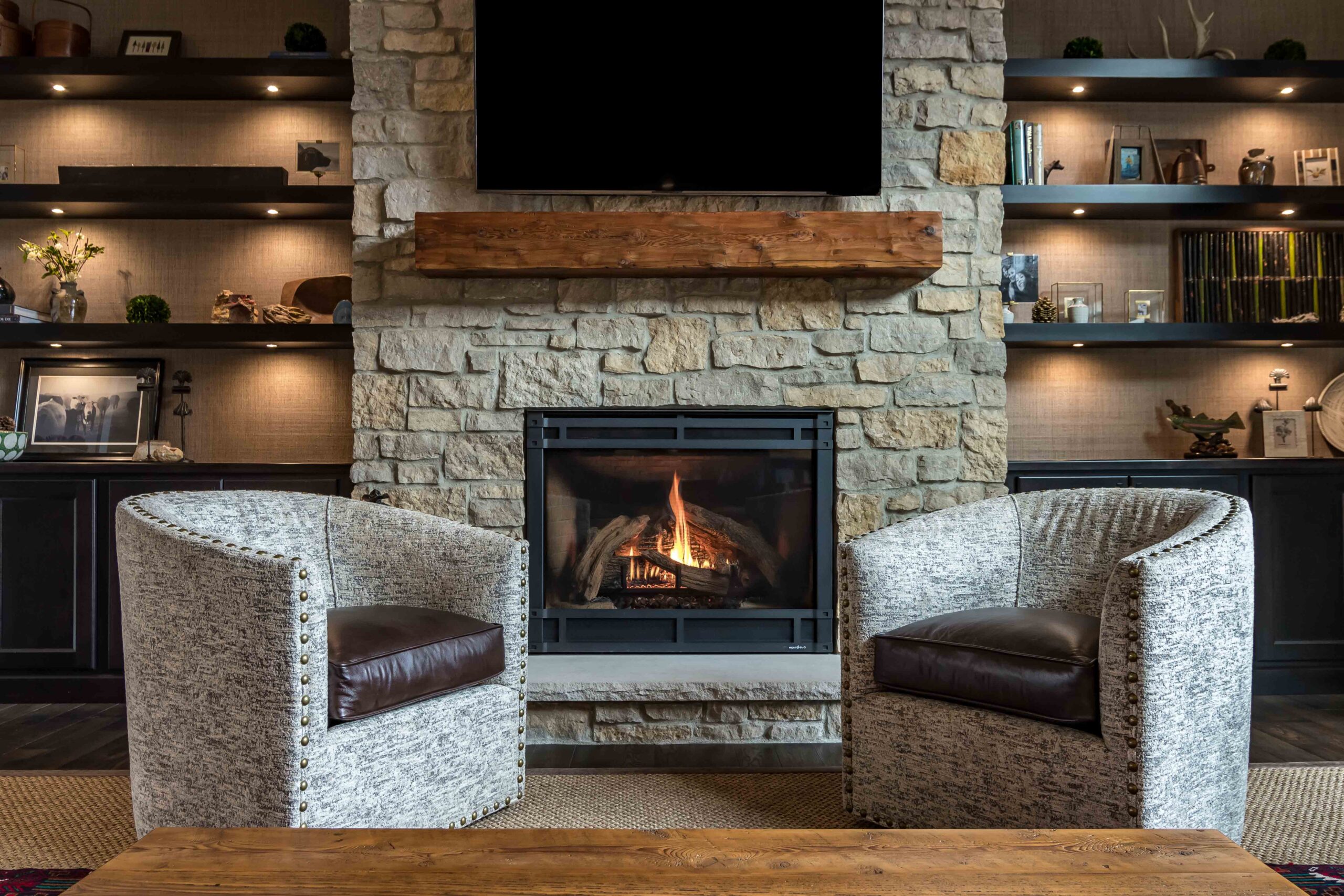 two chair alternatively placed on floor with chimney at home
